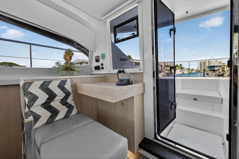  Yacht Photos Pics Interior of 2017 Leopard 43 Powercat yacht with modern seating and marina view.