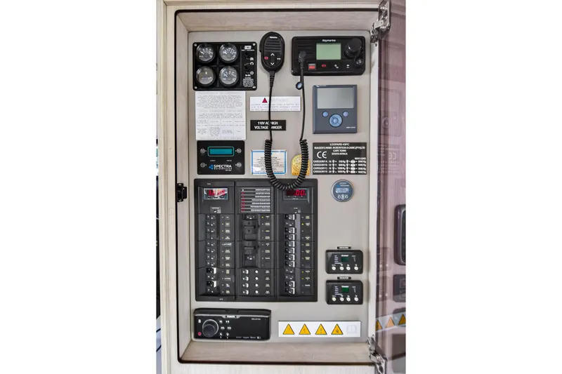  Yacht Photos Pics Electrical control panel of a 2017 Leopard 43 Powercat boat, featuring various gauges and switches.