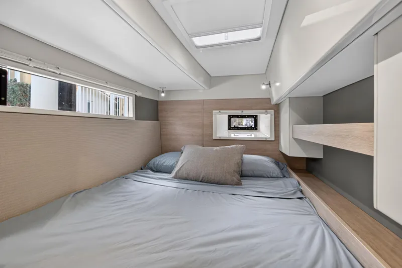  Yacht Photos Pics Cozy bedroom interior of 2017 Leopard 43 Powercat with modern design and natural light.