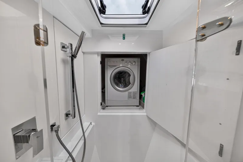  Yacht Photos Pics Laundry area with washing machine in 2017 Leopard 43 Powercat yacht bathroom.