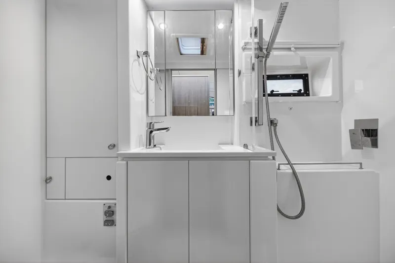  Yacht Photos Pics Modern bathroom interior of 2017 Leopard 43 Powercat yacht, featuring sleek fixtures and minimalist design.