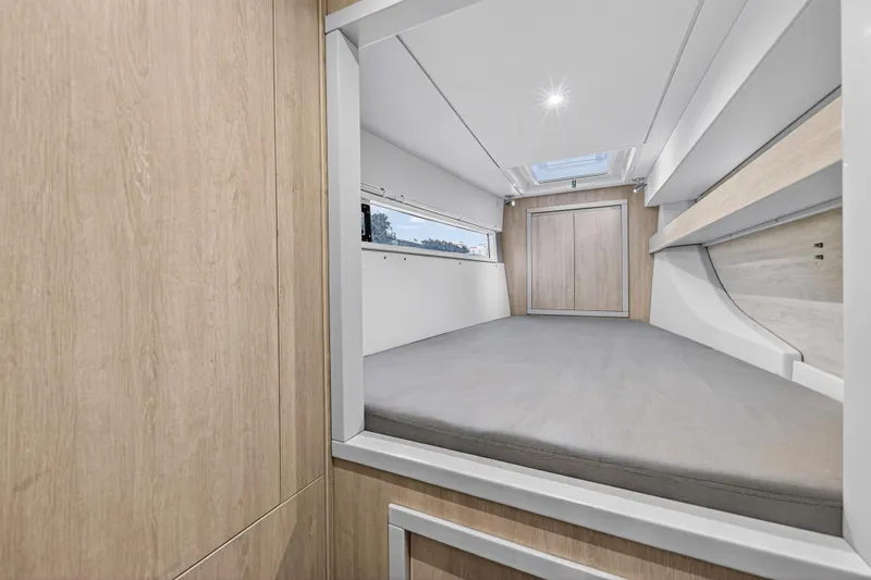  Yacht Photos Pics Interior cabin of 2017 Leopard 43 Powercat with modern wood finish and skylight.