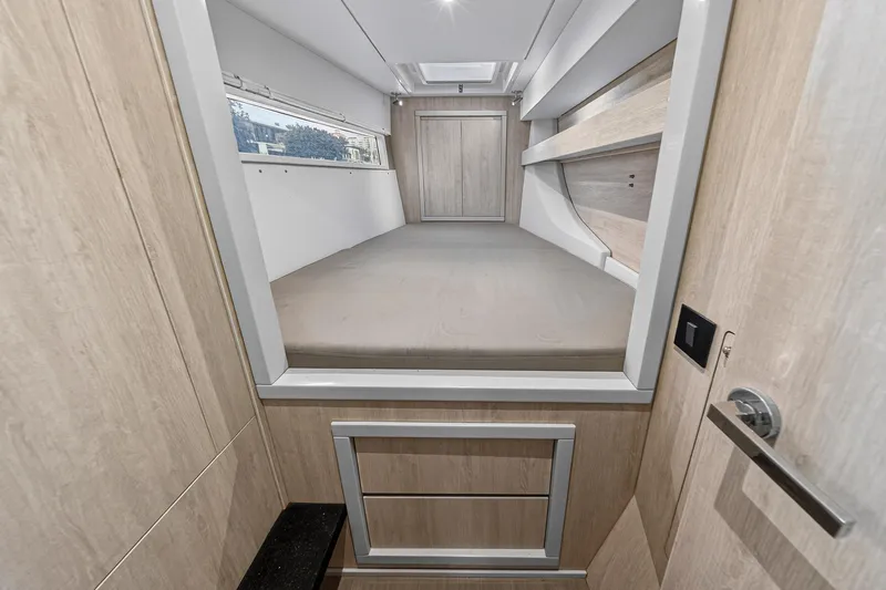  Yacht Photos Pics Interior cabin of 2017 Leopard 43 Powercat with modern wood finish and bed.