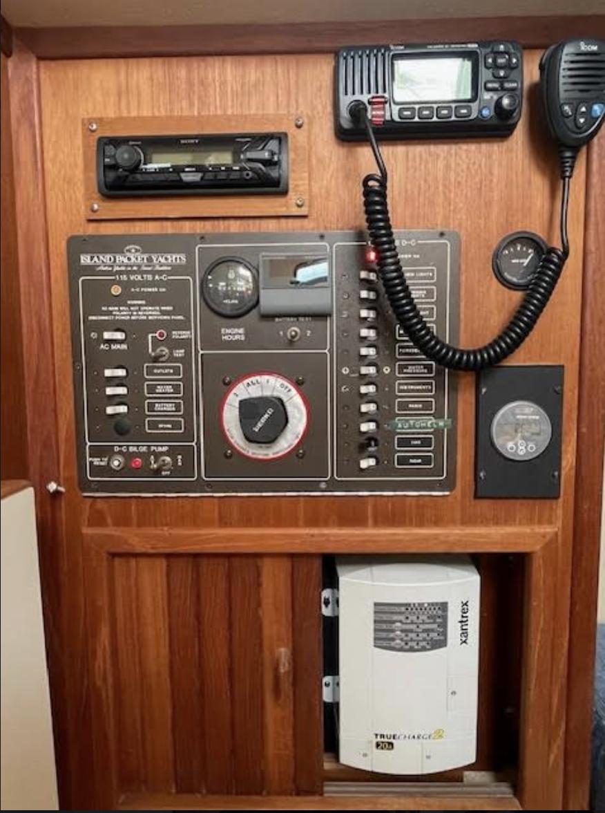 Control panel of a 1987 Island Packet 31 yacht with radio and navigation equipment.