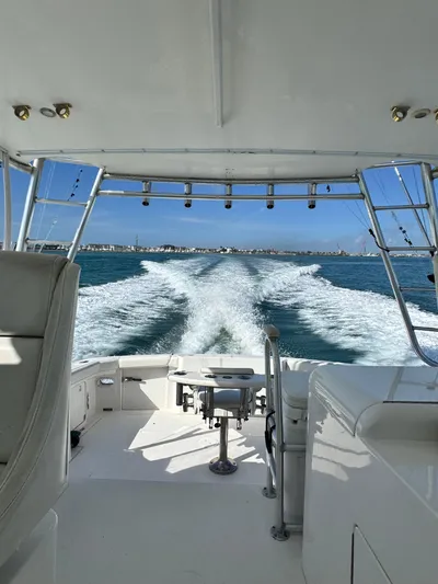 Island Time Yacht Photos Pics 1997 Bertram 36 Moppie cruising on open water, view from the deck.