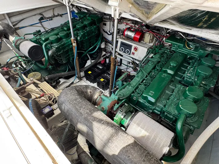 Island Time Yacht Photos Pics Engine room of a 1997 Bertram 36 Moppie with dual green engines and wiring.