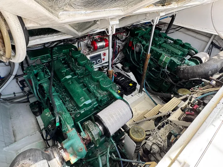 Island Time Yacht Photos Pics Engine room of a 1997 Bertram 36 Moppie with dual green engines.