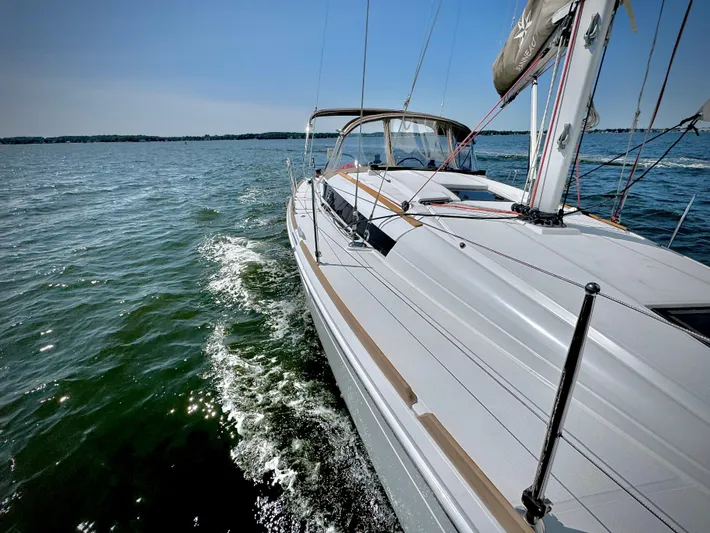 Glide Away Yacht Photos Pics 2015 Jeanneau Sun Odyssey 379 sailing on open water.