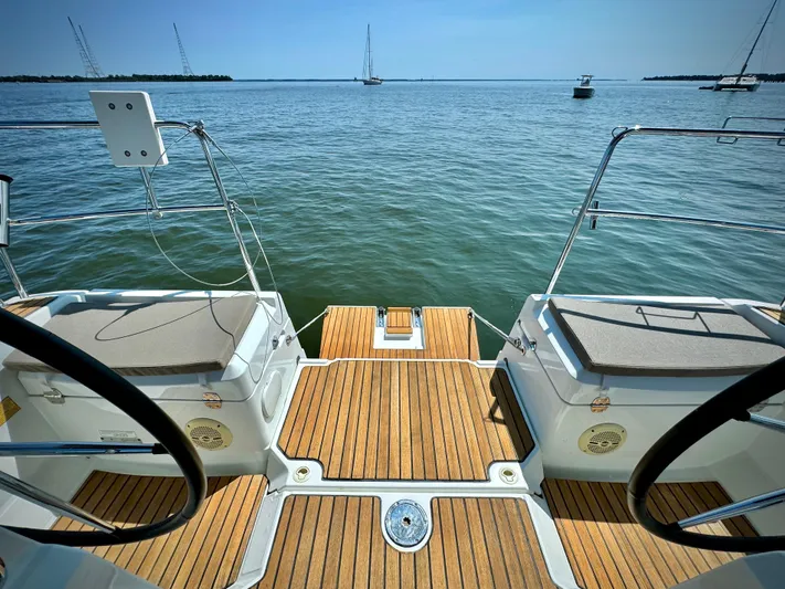 Glide Away Yacht Photos Pics Jeanneau Sun Odyssey 379, 2015 model, teak deck, ocean view, sailboats in distance.