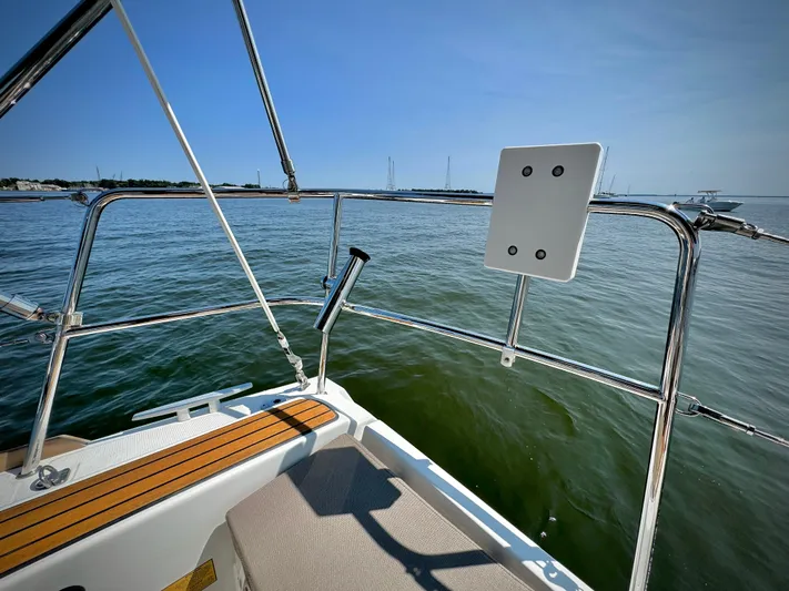Glide Away Yacht Photos Pics 2015 Jeanneau Sun Odyssey 379 sailboat deck overlooking calm waters.
