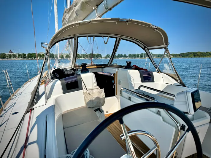 Glide Away Yacht Photos Pics 2015 Jeanneau Sun Odyssey 379 sailboat cockpit on a sunny day.