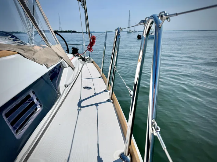 Glide Away Yacht Photos Pics Jeanneau Sun Odyssey 379 sailboat deck, 2015 model, on calm waters.