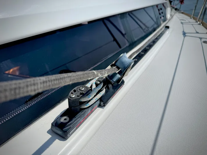 Glide Away Yacht Photos Pics Jeanneau Sun Odyssey 379 sailboat deck detail, 2015 model, featuring rigging and window.