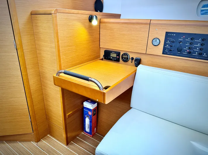Glide Away Yacht Photos Pics Interior of 2015 Jeanneau Sun Odyssey 379, featuring navigation station and control panel.