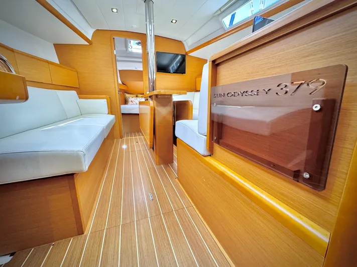 Glide Away Yacht Photos Pics Interior of 2015 Jeanneau Sun Odyssey 379 sailboat with wood finish and modern design.