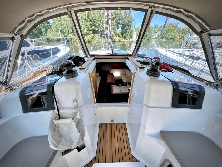 Glide Away Yacht Photos Pics 2015 Jeanneau Sun Odyssey 379 cockpit with teak flooring and dual helm stations.