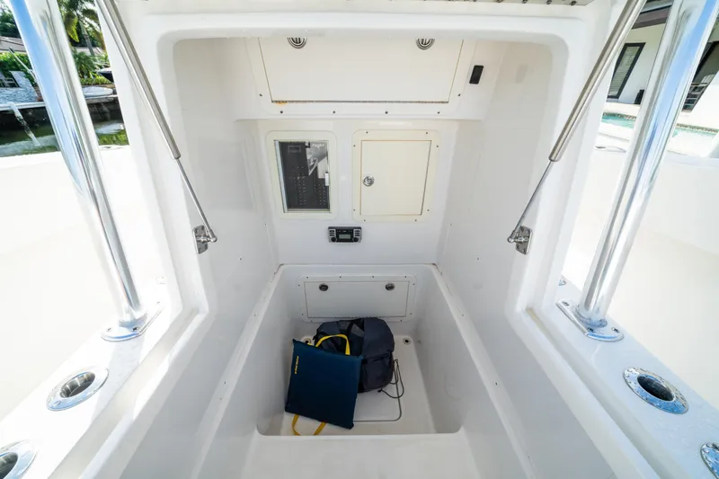 Carried Away Yacht Photos Pics 2016 Invincible 36 Open Fisherman boat interior with storage compartment and control panel.