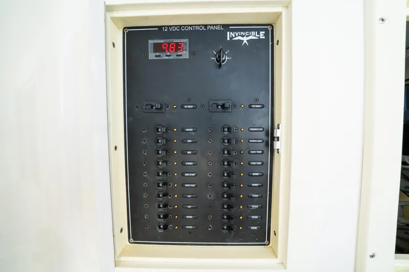 Carried Away Yacht Photos Pics Control panel of 2016 Invincible 36 Open Fisherman boat, displaying voltage and switches.