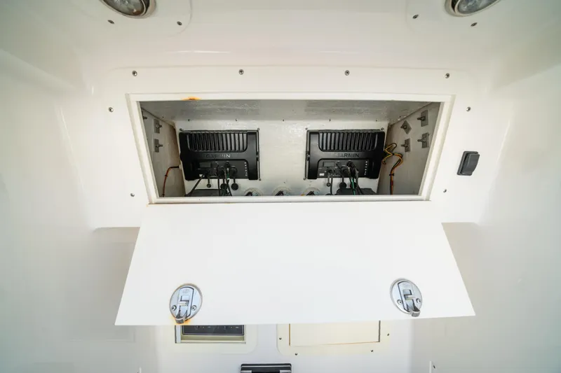 Carried Away Yacht Photos Pics 2016 Invincible 36 Open Fisherman electronics compartment with Garmin equipment.