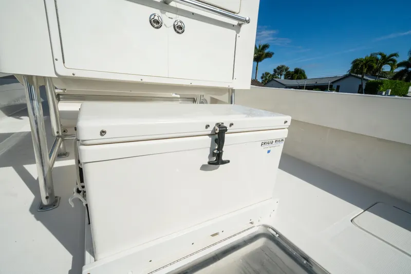 Carried Away Yacht Photos Pics 2016 Invincible 36 Open Fisherman boat deck with storage compartment and cooler.