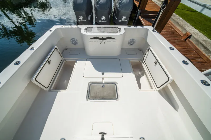 Carried Away Yacht Photos Pics 2016 Invincible 36 Open Fisherman boat deck with storage compartments and Mercury engines.