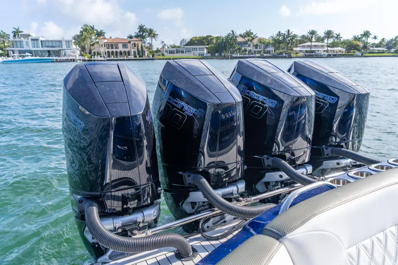 Work From Home Yacht Photos Pics 2024 Nor-Tech 390 Sport boat with four powerful outboard engines on a sunny day.