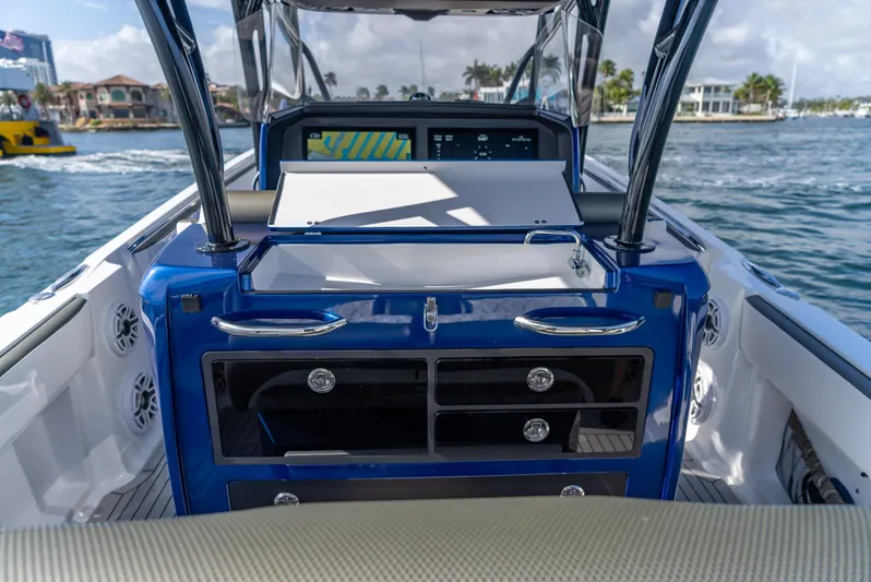 Work From Home Yacht Photos Pics 2024 Nor-Tech 390 Sport boat interior with modern dashboard and ocean view.