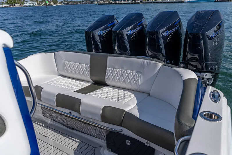 Work From Home Yacht Photos Pics 2024 Nor-Tech 390 Sport boat with luxurious seating and powerful engines on the water.