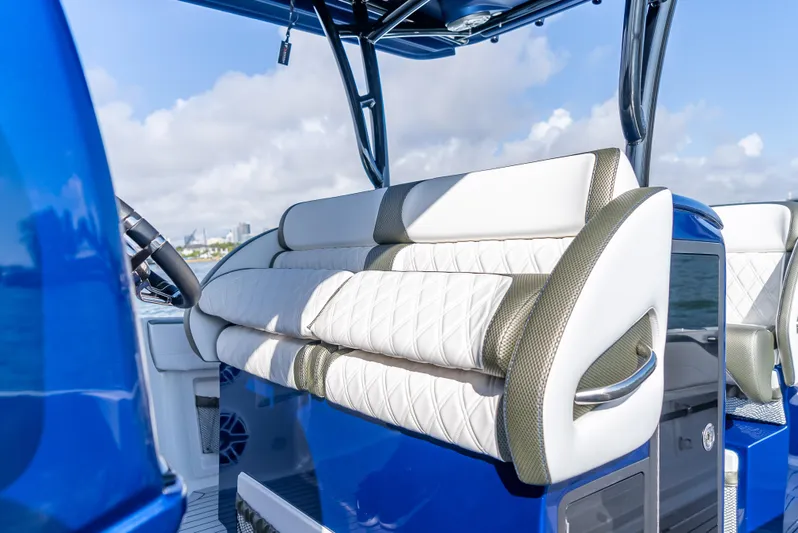 Work From Home Yacht Photos Pics 2024 Nor-Tech 390 Sport boat interior with luxurious seating and modern design.