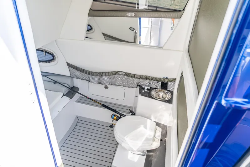 Work From Home Yacht Photos Pics 2024 Nor-Tech 390 Sport boat interior with modern bathroom amenities.