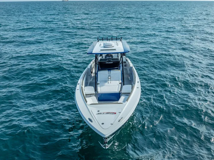 Work From Home Yacht Photos Pics 2024 Nor-Tech 390 Sport boat cruising on open water.