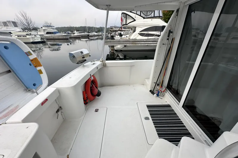 Lucky Dog Yacht Photos Pics 2002 Mainship 390 Trawler docked, featuring spacious deck and marina view.