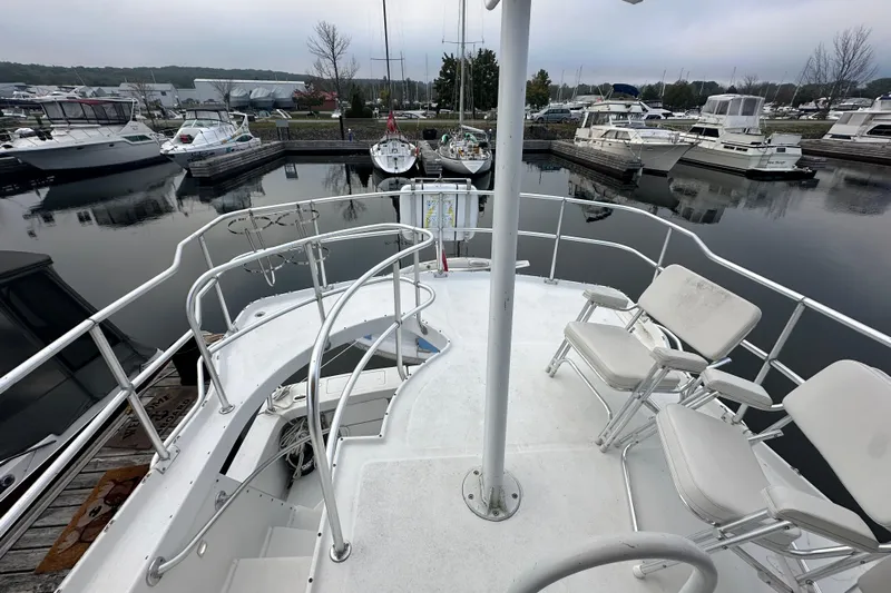 Lucky Dog Yacht Photos Pics 2002 Mainship 390 Trawler deck view in marina with surrounding boats.