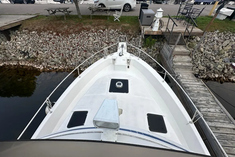 Lucky Dog Yacht Photos Pics 2002 Mainship 390 Trawler docked, view of bow and surrounding marina.