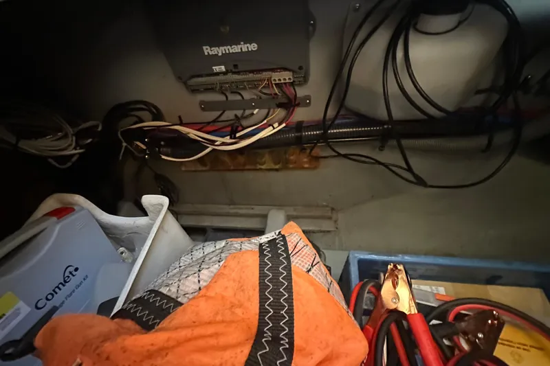 Lucky Dog Yacht Photos Pics 2002 Mainship 390 Trawler interior with Raymarine equipment and various boating supplies.