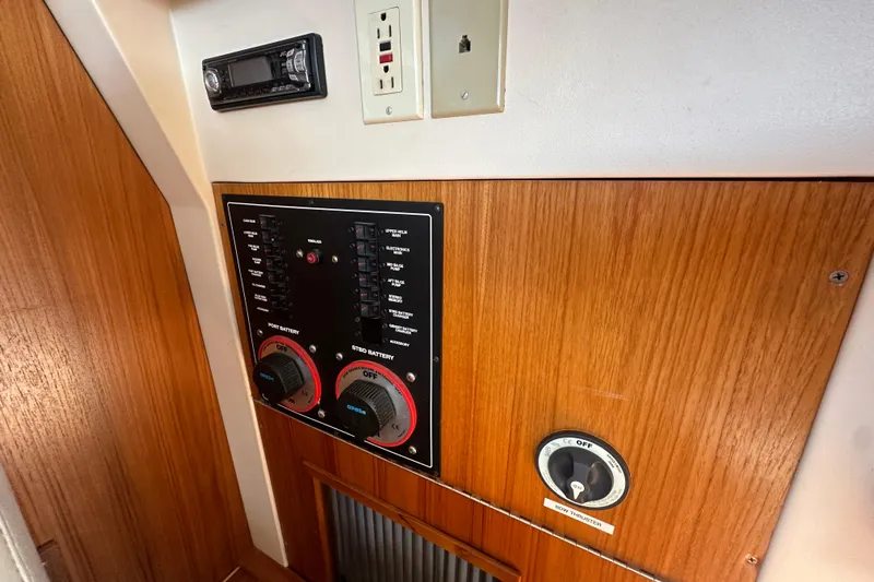 Lucky Dog Yacht Photos Pics Control panel on 2002 Mainship 390 Trawler with switches and battery dials.