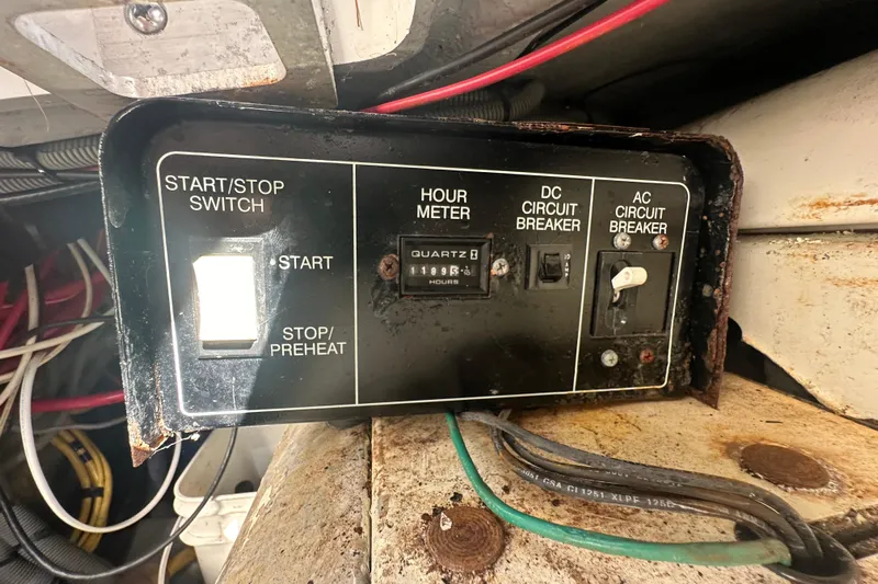 Lucky Dog Yacht Photos Pics Control panel of a 2002 Mainship 390 Trawler with start/stop switch and circuit breakers.