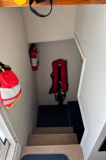  Yacht Photos Pics Stairway in 2010 Ocean Sport Roamer with life jacket and fire extinguisher.