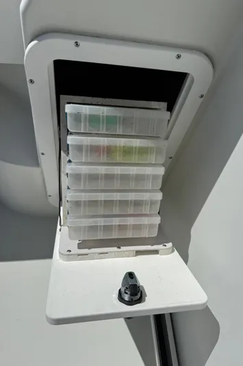  Yacht Photos Pics Storage compartment with tackle boxes on a 2010 Ocean Sport Roamer boat.