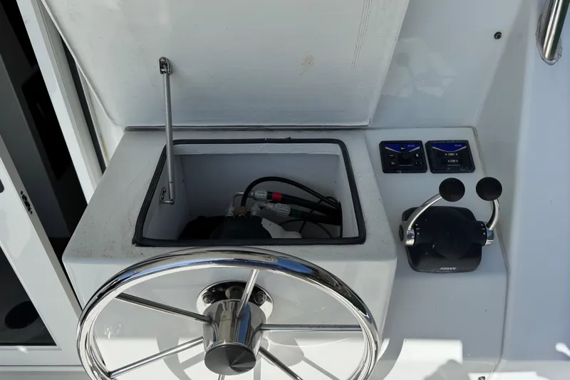  Yacht Photos Pics Steering wheel and controls of a 2010 Ocean Sport Roamer boat.