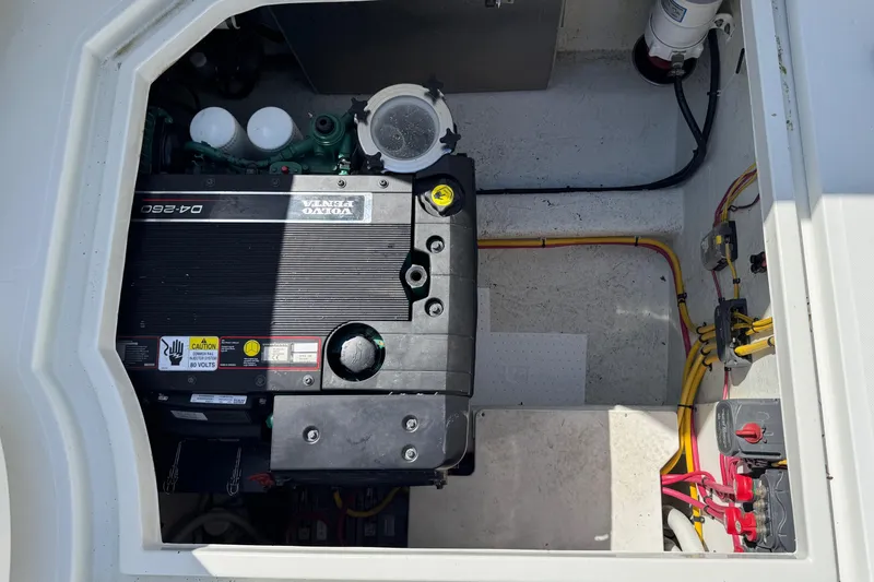  Yacht Photos Pics Engine compartment of a 2010 Ocean Sport Roamer boat, featuring a Volvo Penta engine.
