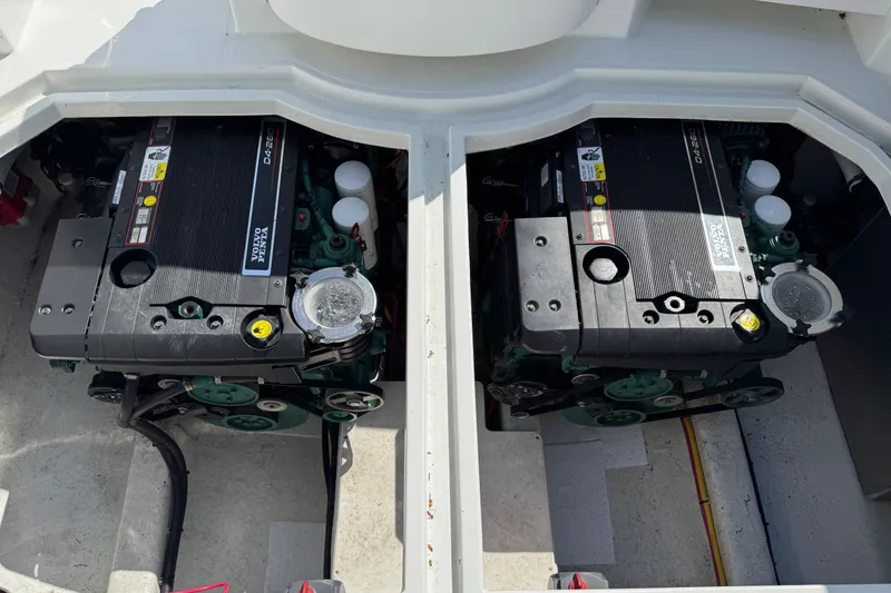  Yacht Photos Pics Twin engines in a 2010 Ocean Sport Roamer boat, showcasing powerful marine engineering.