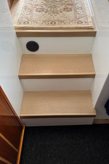  Yacht Photos Pics Wooden steps with carpet runner on a 2010 Ocean Sport Roamer boat.
