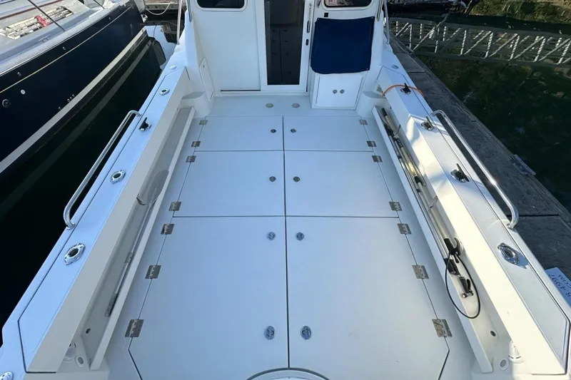  Yacht Photos Pics 2010 Ocean Sport Roamer boat deck with spacious layout and sleek design.