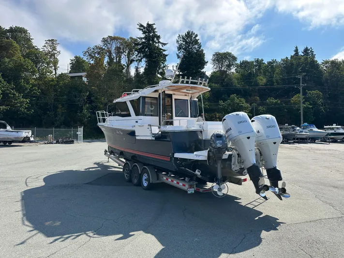  Yacht Photos Pics 2018 Cutwater C-302 Coupe boat on trailer with dual Yamaha engines, parked outdoors.