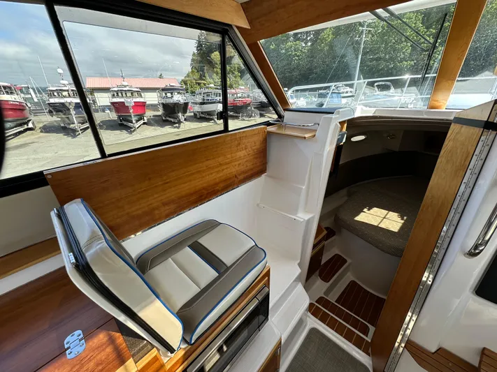  Yacht Photos Pics Interior of 2018 Cutwater C-302 Coupe boat, featuring seating and cabin area.
