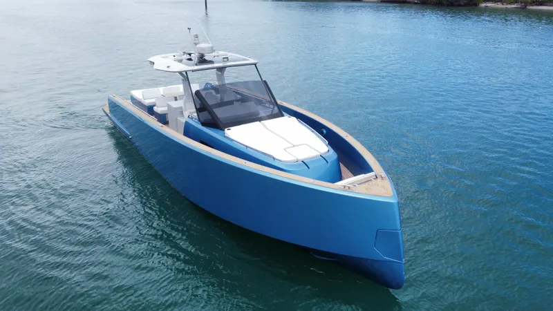  Yacht Photos Pics 2022 Pardo Yachts 43 in blue, cruising on calm waters.