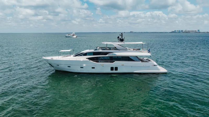 Sasa Yacht Photos Pics 2022 Sanlorenzo SL86 yacht cruising on open water under a partly cloudy sky.