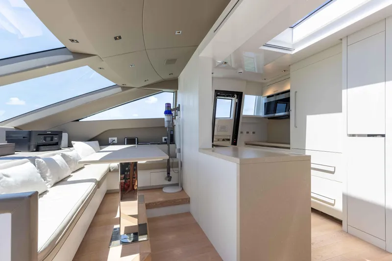 Sasa Yacht Photos Pics Luxurious interior of 2022 Sanlorenzo SL86 yacht with modern kitchen and seating area.