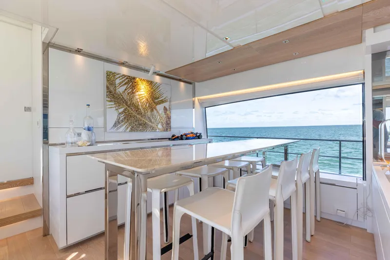 Sasa Yacht Photos Pics Luxurious Sanlorenzo SL86 yacht interior with ocean view, modern dining area, and elegant decor.
